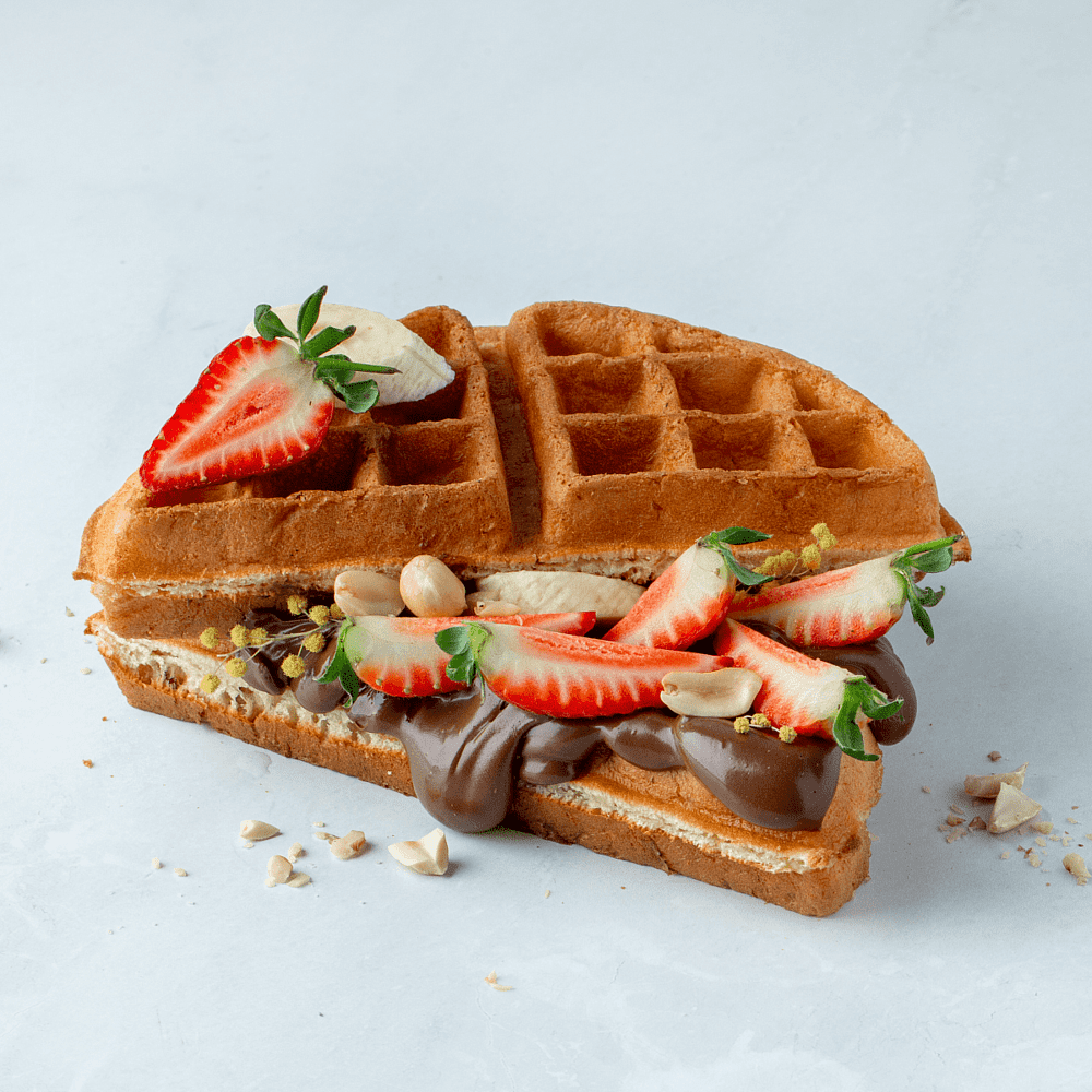 Belgian waffle with nutella and fruits 